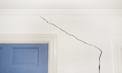crack in drywall above door
