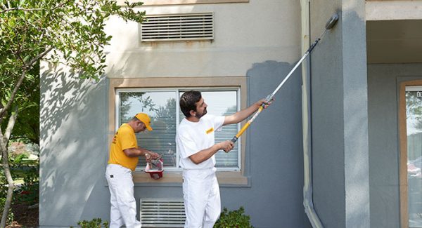 Exterior painting contractors working outside.