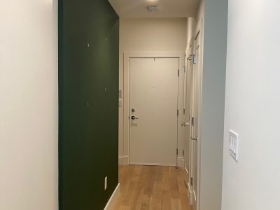Apartment Makeover with a dark green wall accent
