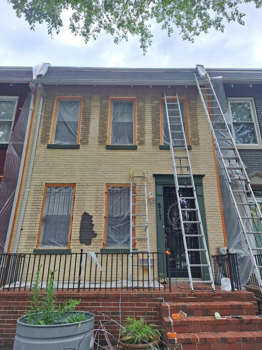 ladder leaning against front of brick townhouse before painting Preview Image 1