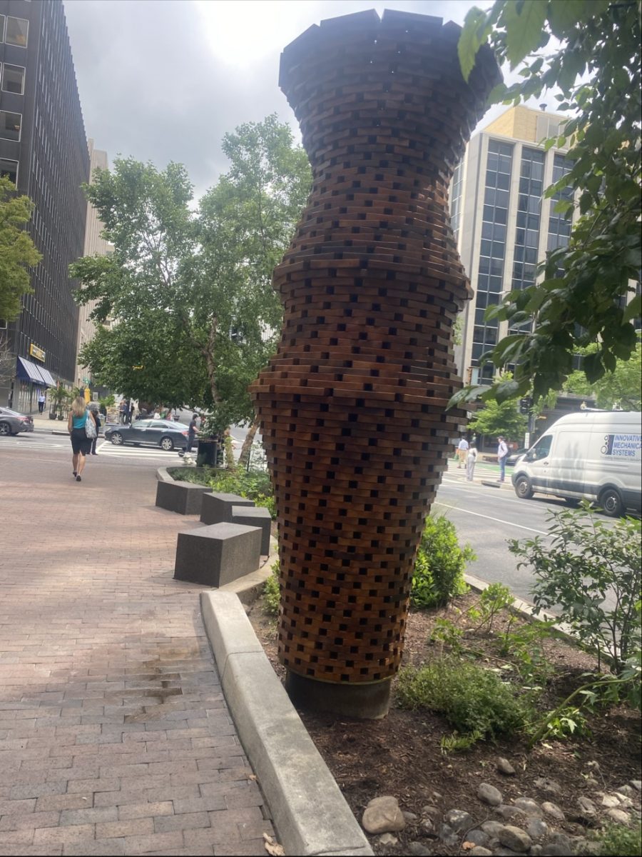 wooden art installation sculpture on city sidewalk Preview Image 1