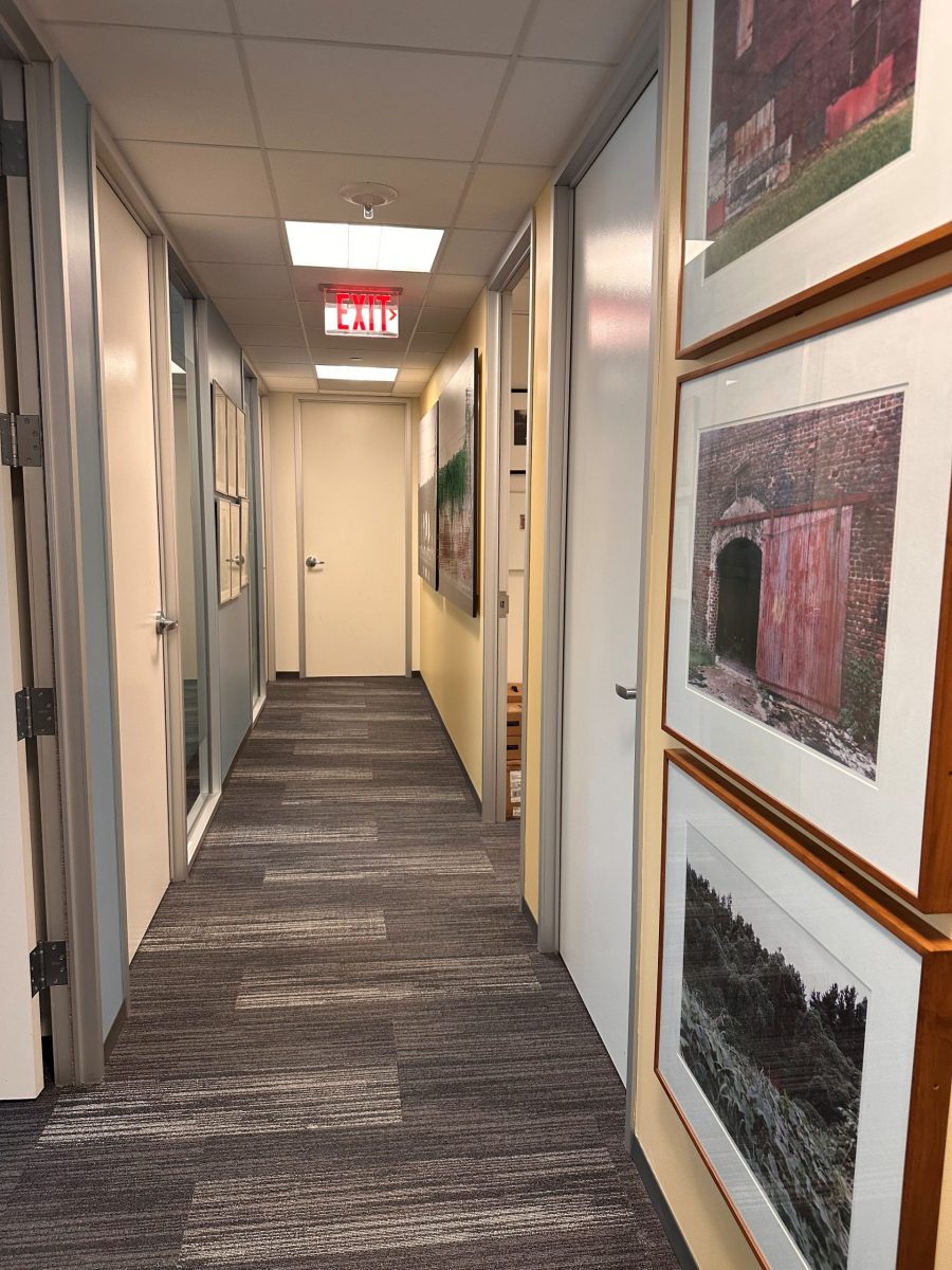 painted office hallway with framed artwork on walls Preview Image 3