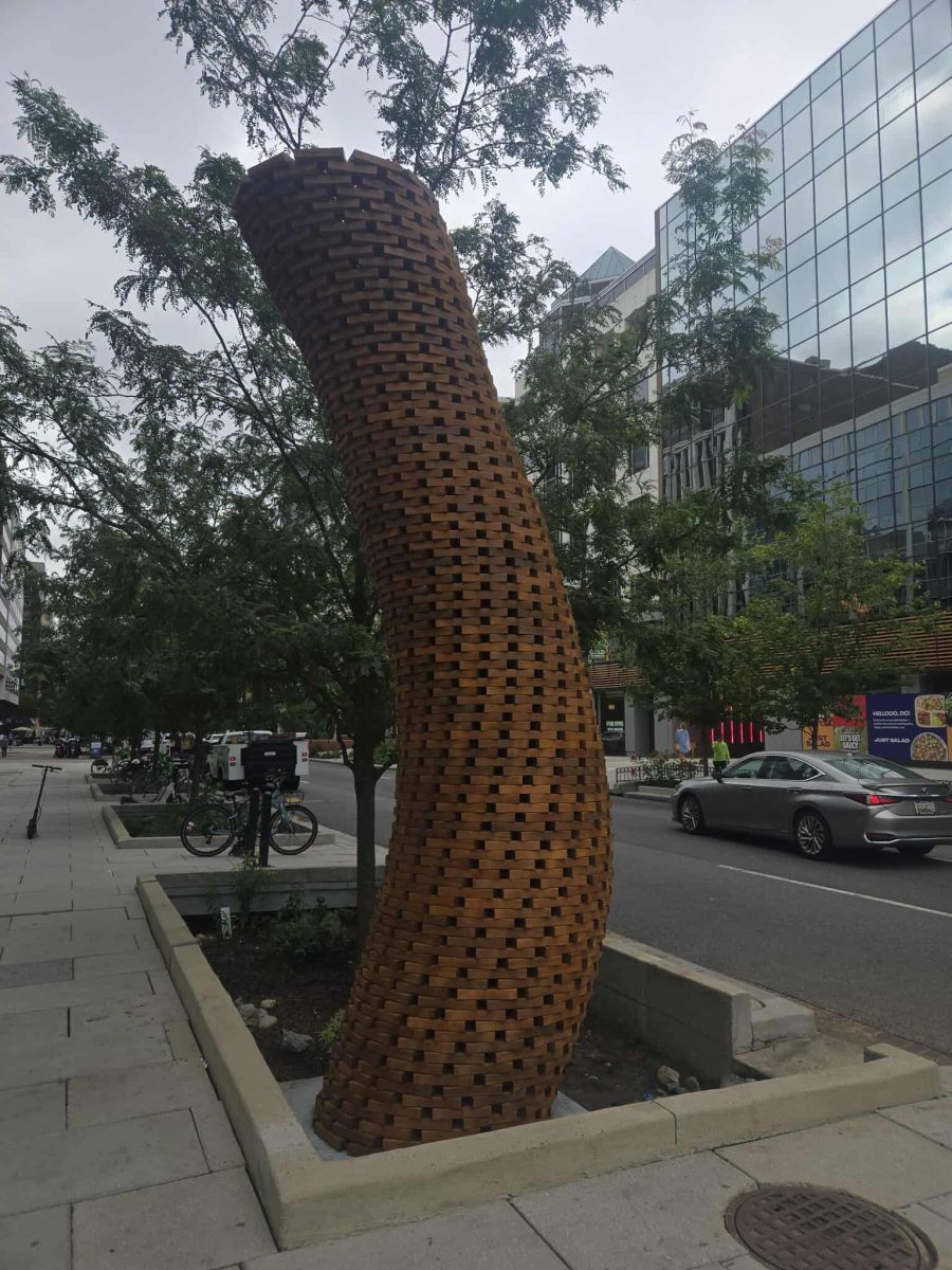 wooden art installation sculpture on city sidewalk Preview Image 4