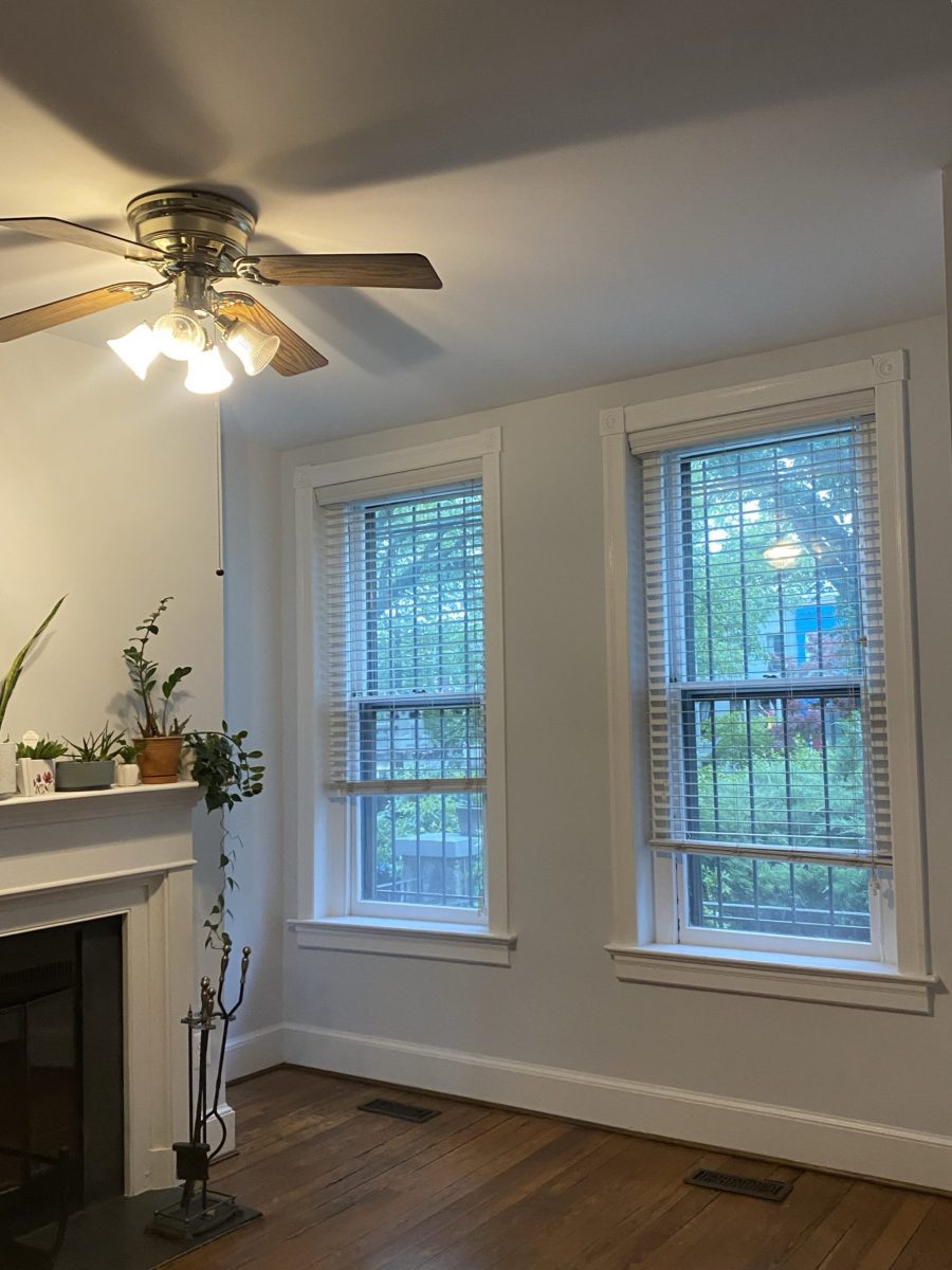 living room interior with fireplace and front windows
