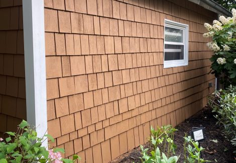 side exterior wall of house with cedar shake siding