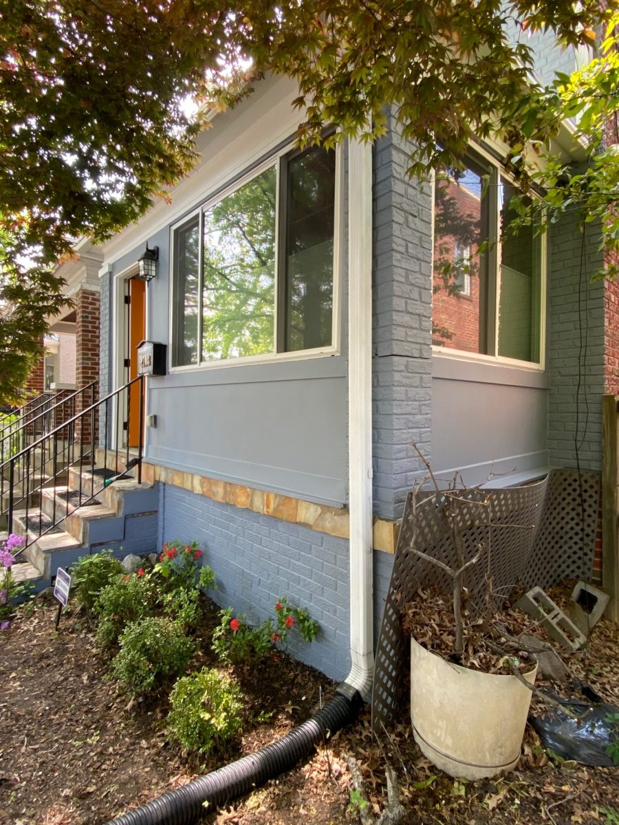 Side view of brick townhome repainted gray Preview Image 1