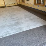 Garage floor coating in progress.