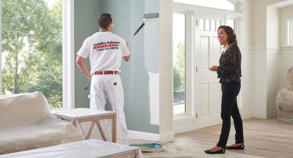 certapro employee painting the interior of a home