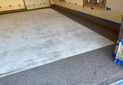Garage floor coating in progress.