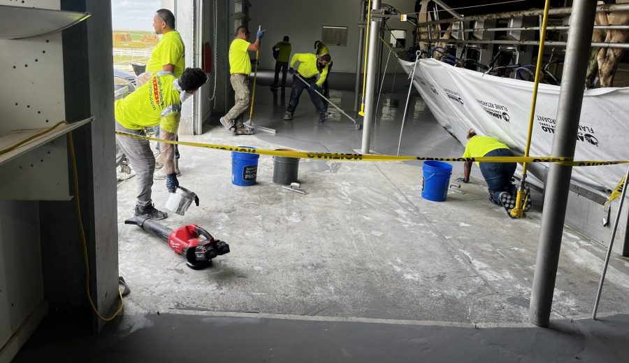 McCarty Farms Commercial Flooring Project spreading product on a large area of flooring Preview Image 6