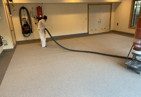 Garage floor coating in progress.