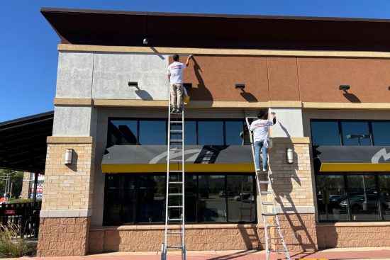 Retail Shops Case Study During photo men working on ladders