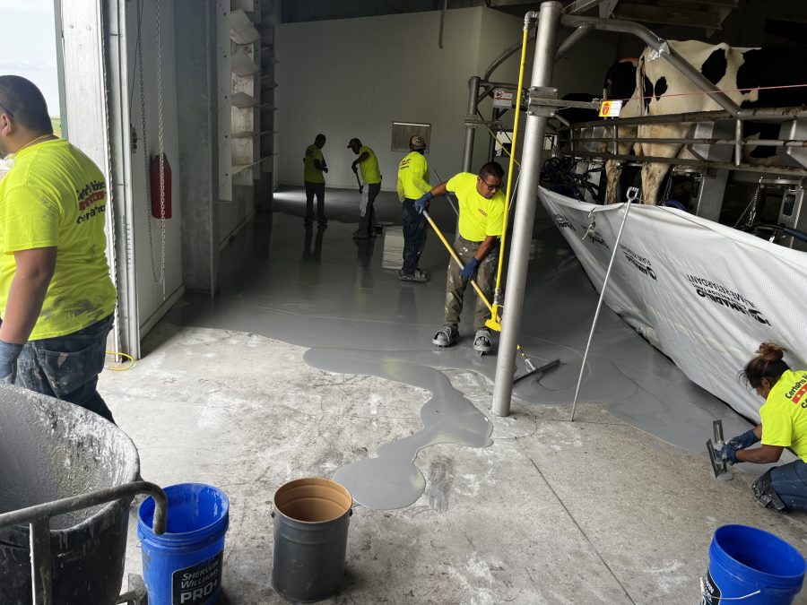 McCarty Farms Commercial Flooring Project spreading product on loading dock area Preview Image 14