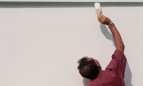 Man Painting Stucco