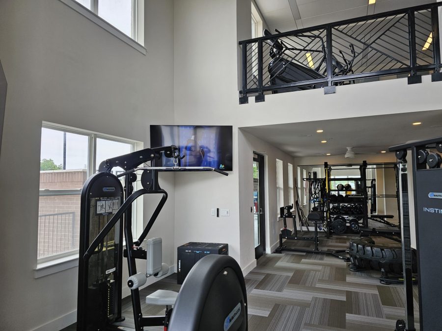 Gym area after photo looking at a treadmill Preview Image 22