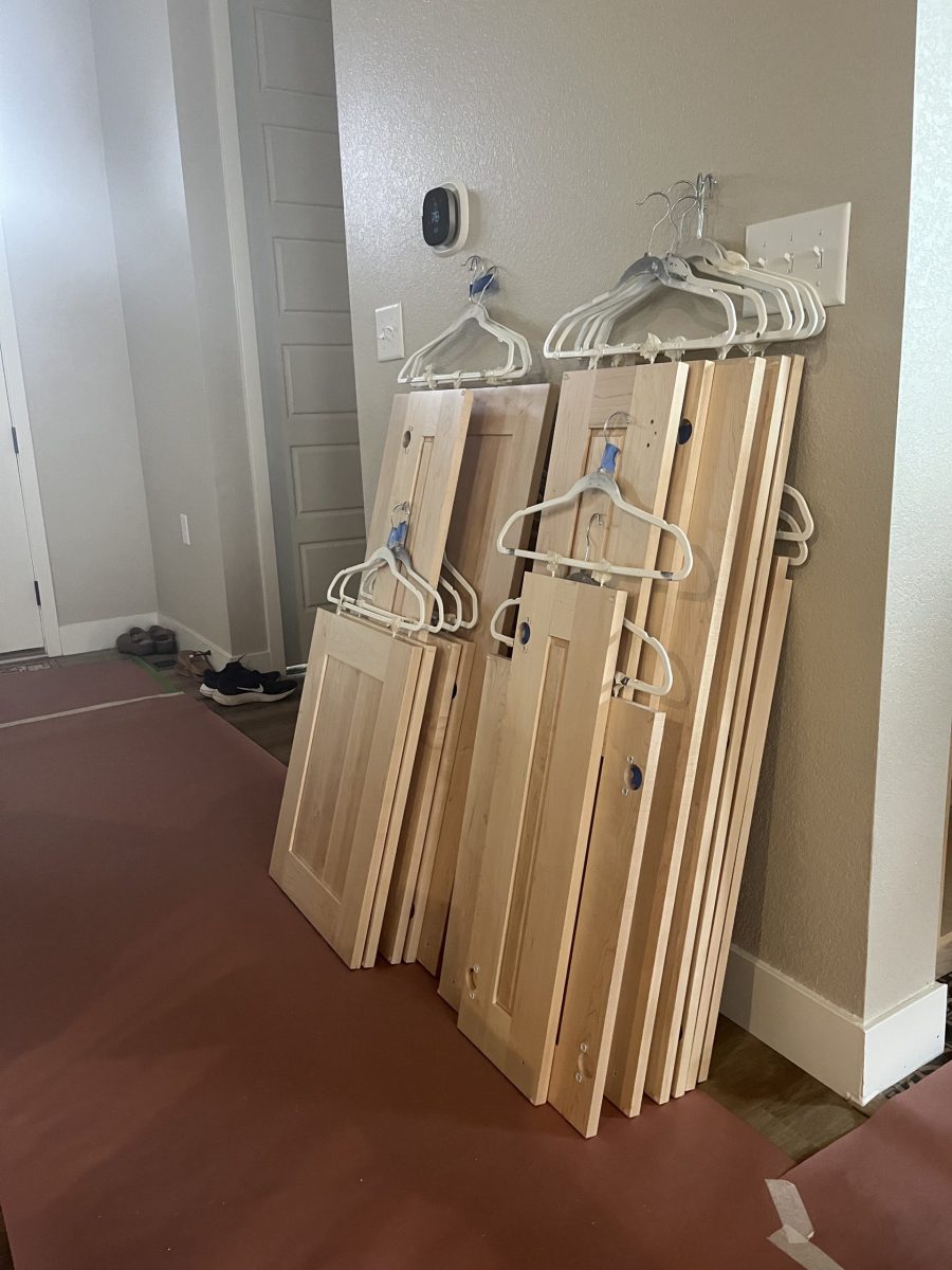 natural wood cabinet doors stacked against a wall Preview Image 3