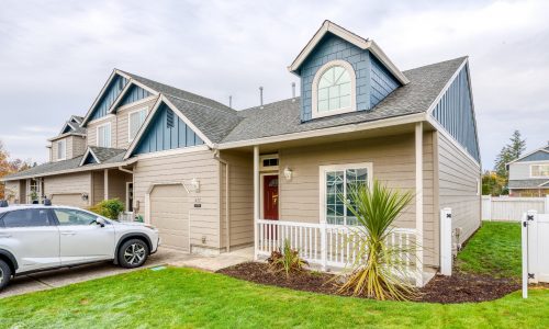 Lawn Angle - Tan Base, Blue Attics, a Grey Roof & White Trim