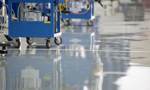 Commercial workshop floor glossy epoxy service for car repair by CertaPro Painters of Winston-Salem.