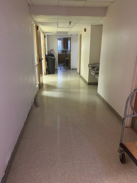 Baptist church hallway with brick wall painting touch-up by CertaPro Painters of Winston-Salem Preview Image 8