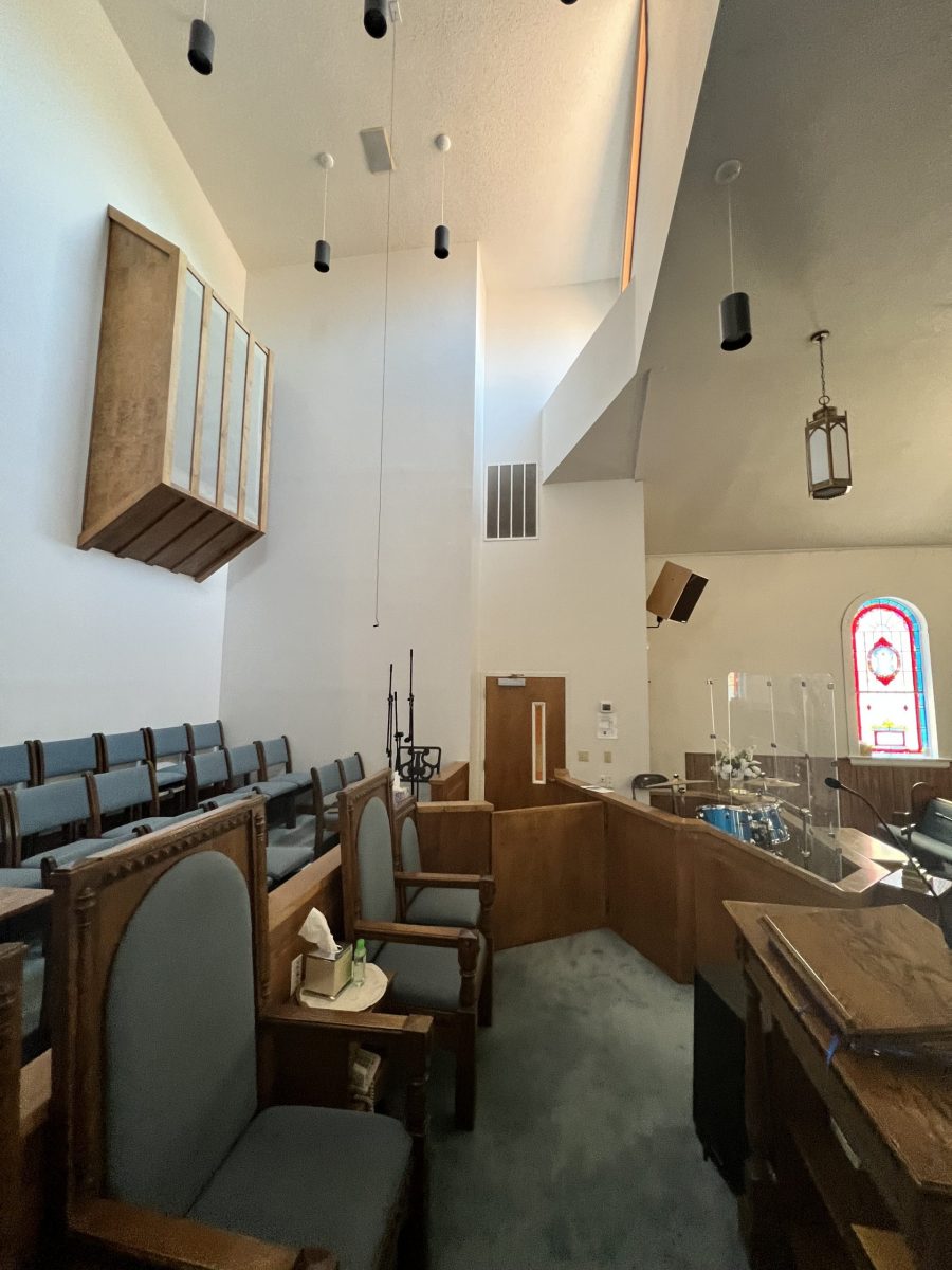 Entrance and pew view of brick painting restoration religious facility painting job in Winston-Salem Preview Image 3