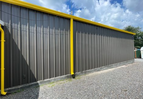 Side painting of metal sheet and poles for industrial painting.