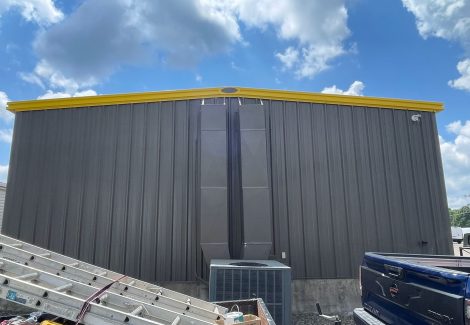 Backside of industrial facility for Leonard Trucking painting.