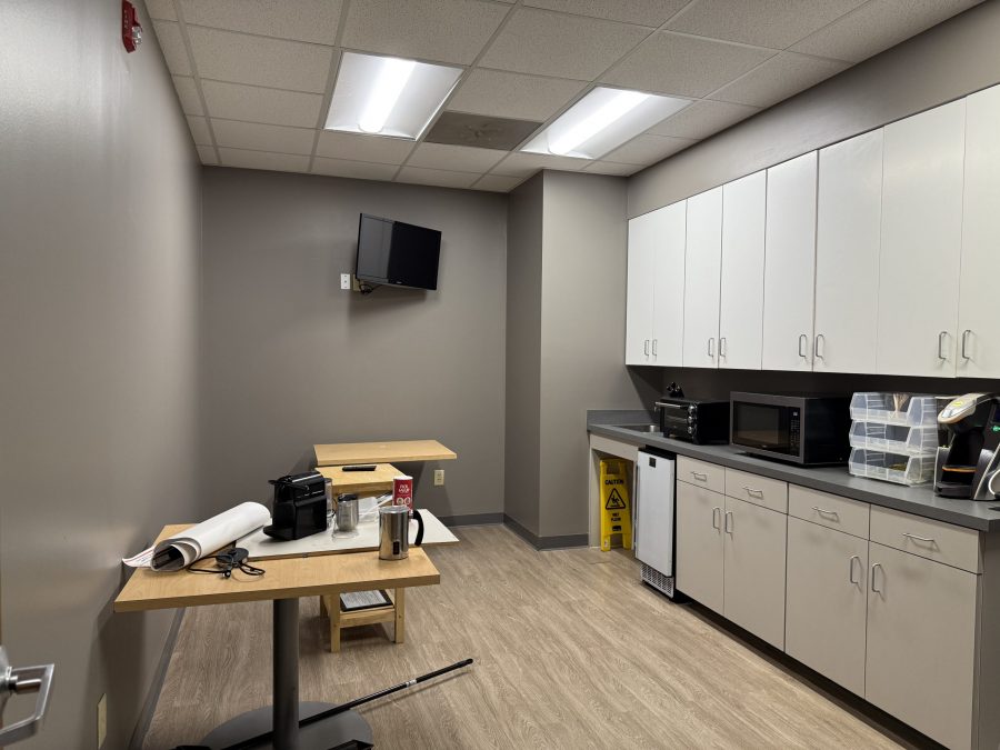 Kitchen and storage space painting cabinets for commercial project. Preview Image 9