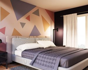 bedroom with accent wall and complimentary colors