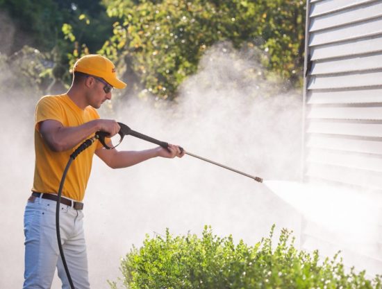 certapro employee using power washing equipment