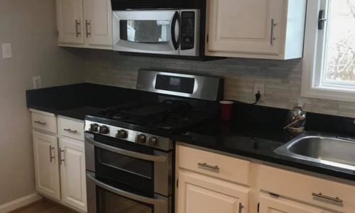 White Cabinet With Black Countertop