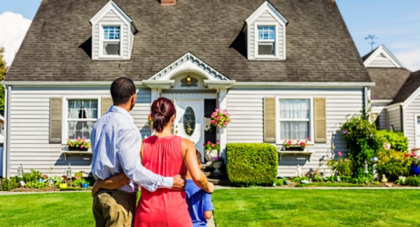 family looking at newly painted home