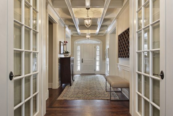 Upscale foyer in home with crown molding