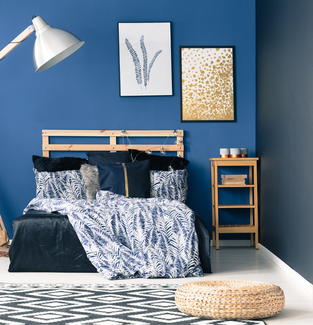 blue accent wall in bedroom