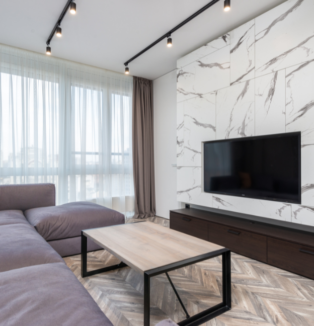 white and black accent wall with tv on it