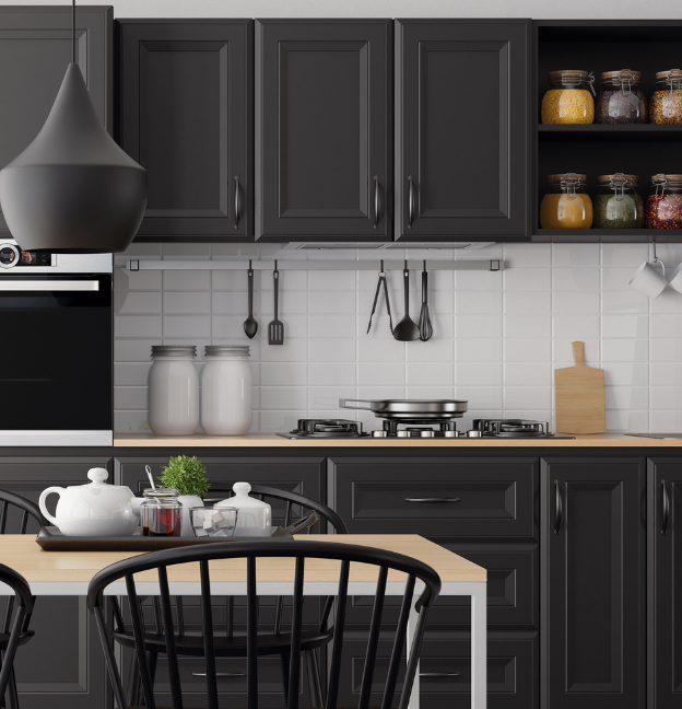 kitchen in home with black kitchen cabinets