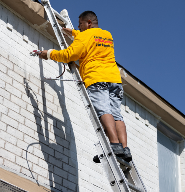 brick painting by certapro painters crew member