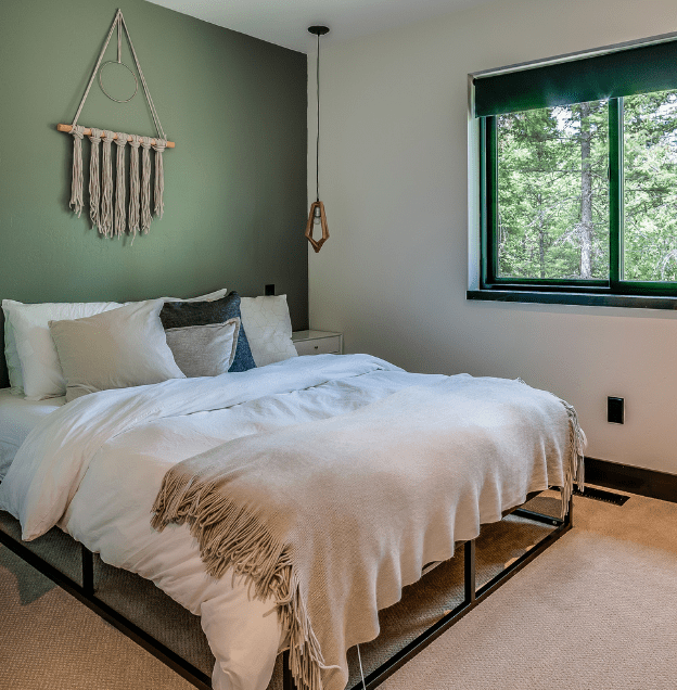 green accent wall in bedroom