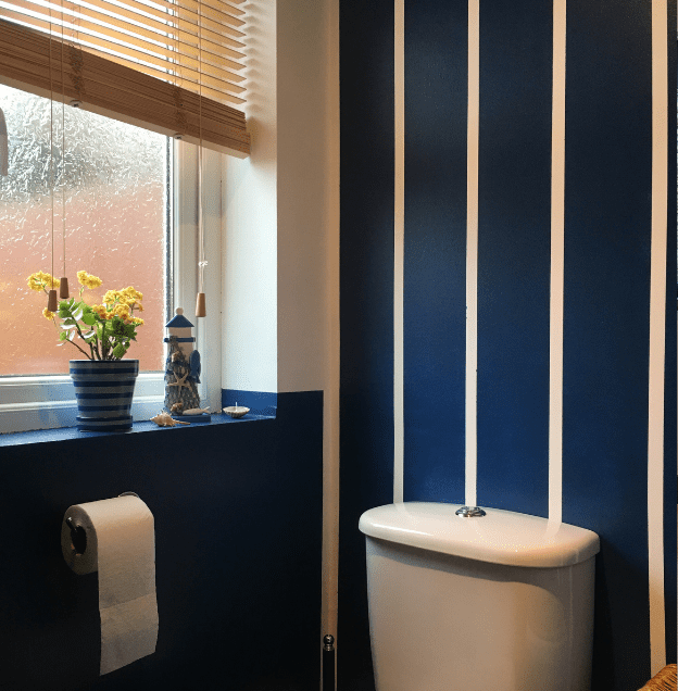 bathroom with blue and white striped walls