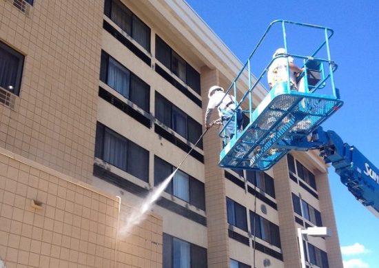 painteres cleaning exterior of hotel